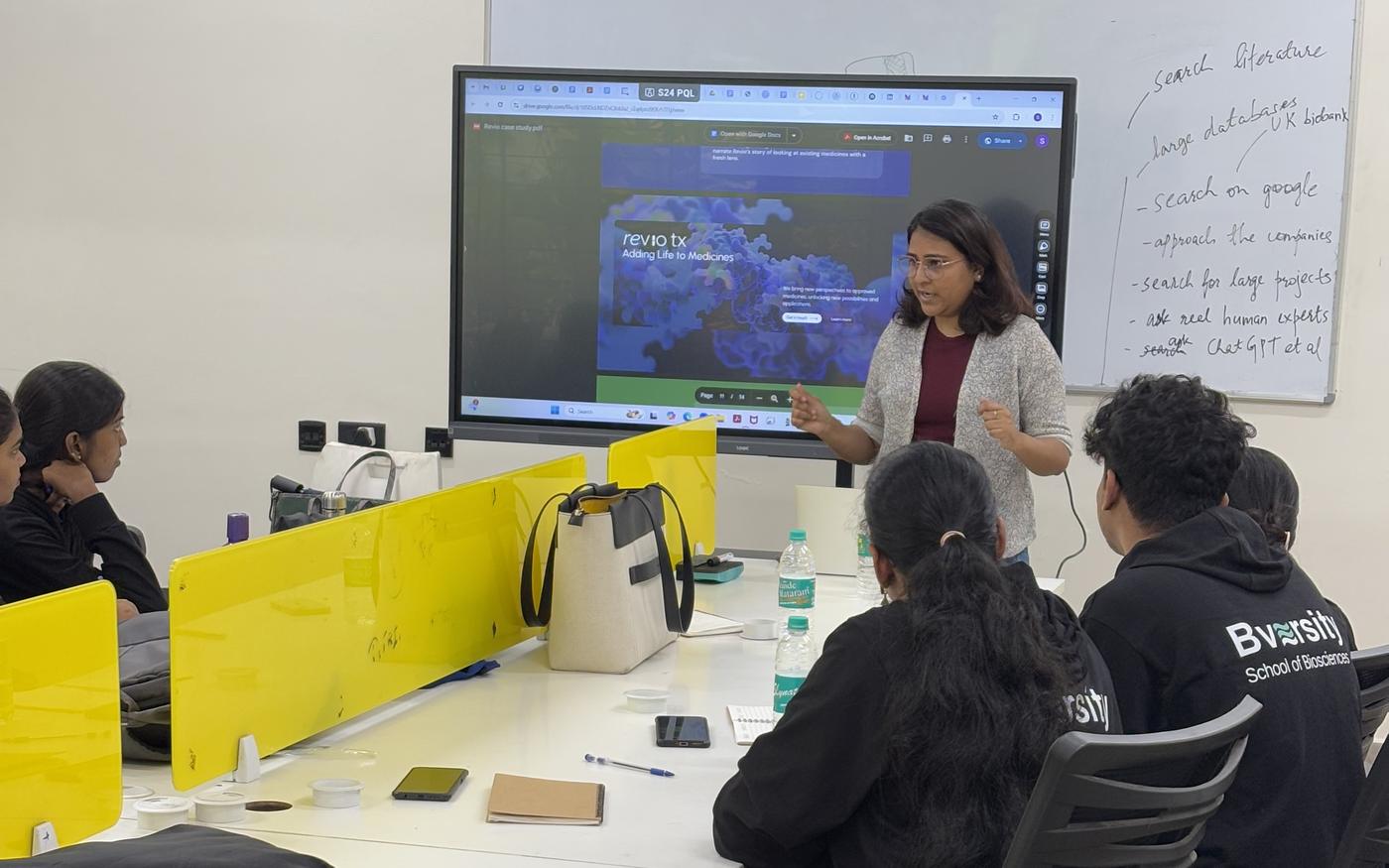 A specialist walking a group through a data tool